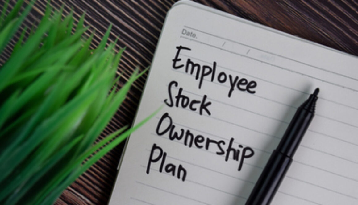 Employee Stock Ownership Plan write on a book isolated wooden table.