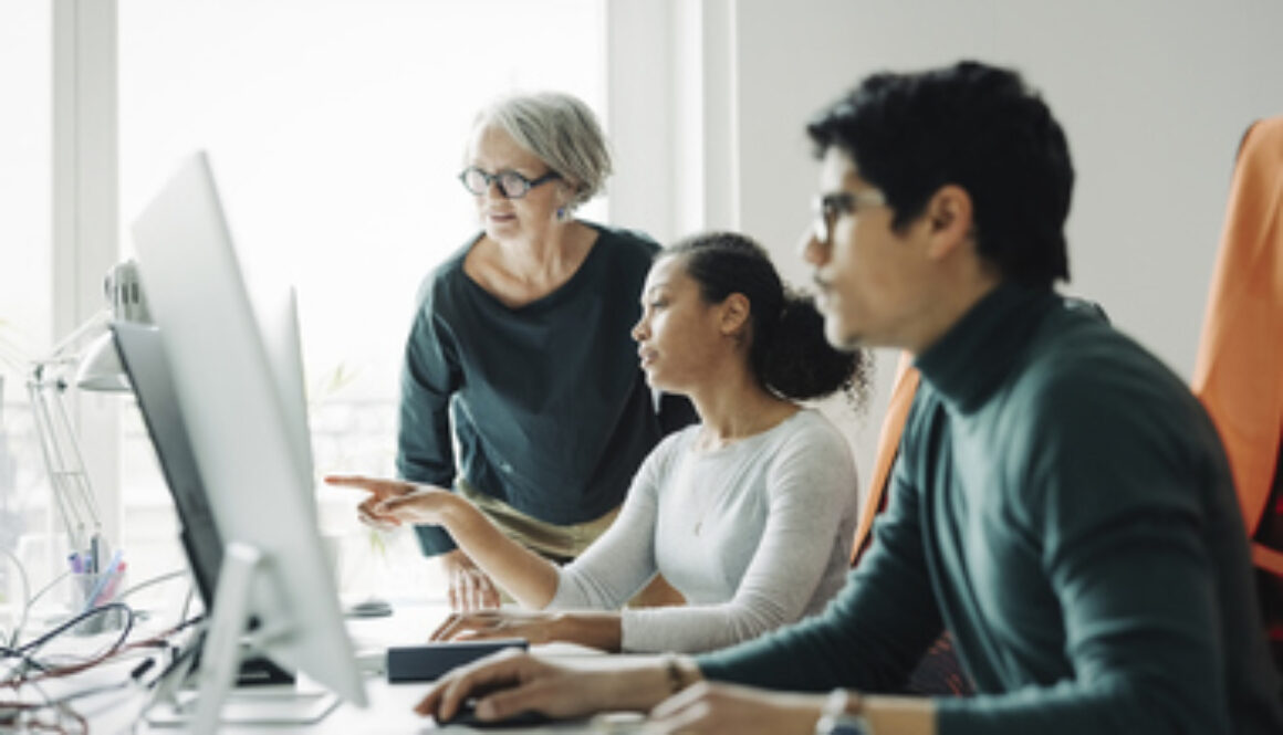 Business people working together in an engineering office