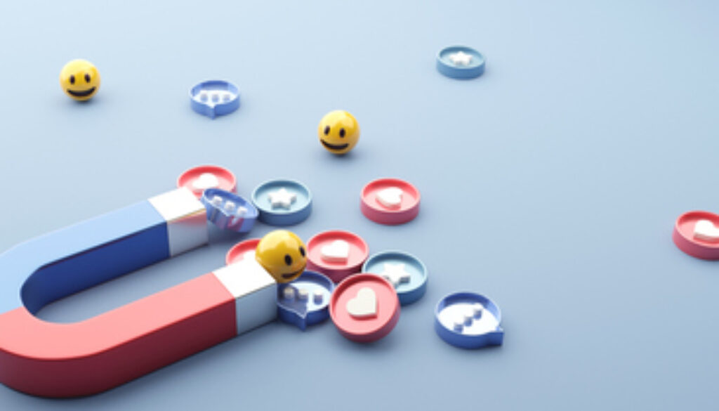 Social media marketing concept. Attracting (emoji, like, love, star, comment icon) with a huge magnet.
