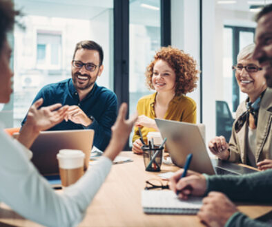 Business people sitting around the table and talking