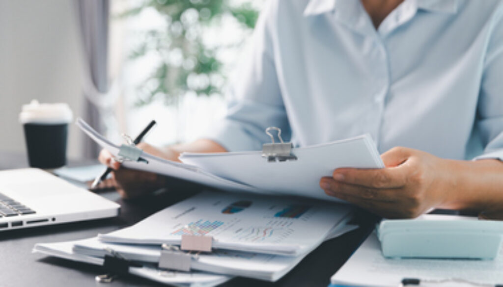 Business person with contract law and paper work for business finance, loan application form, contract real estate and insurance concept. signing contract, working on desk, business document