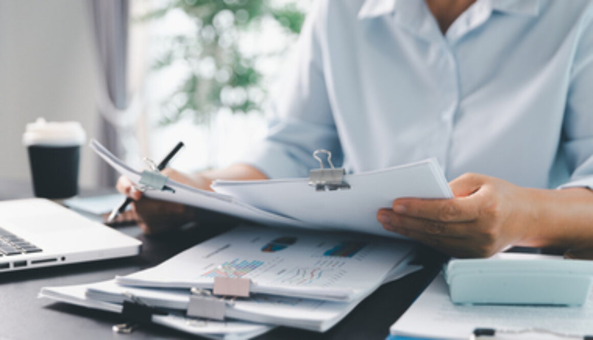 Business person with contract law and paper work for business finance, loan application form, contract real estate and insurance concept. signing contract, working on desk, business document