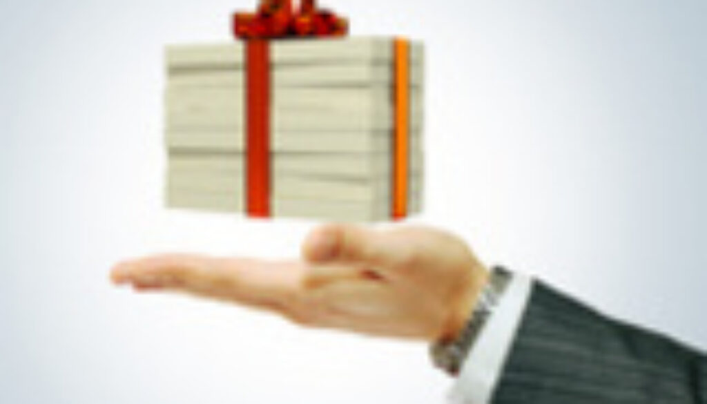 Money concept dollars in the form of a gift box in hand