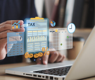 Tax concept. Person using computer to fill out personal income tax return to pay taxes online. State tax. Financial research. data analysis, documents, reports, tax returns, calculations.