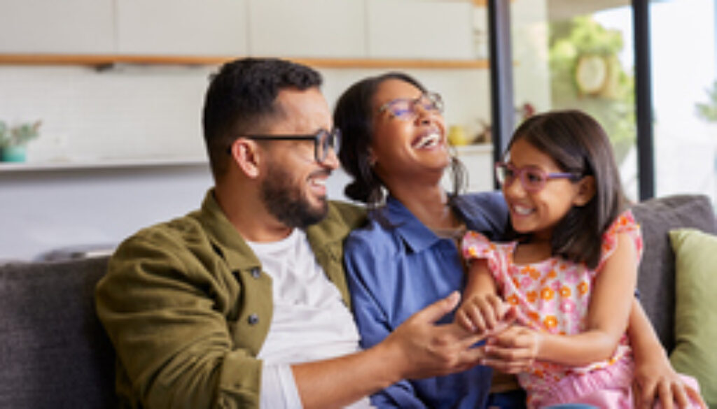 Parents playing with daughter at home