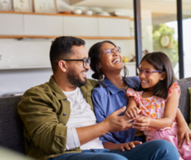 Parents playing with daughter at home