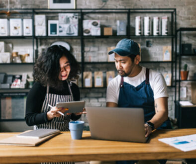 Small business owners working behind cafe counter