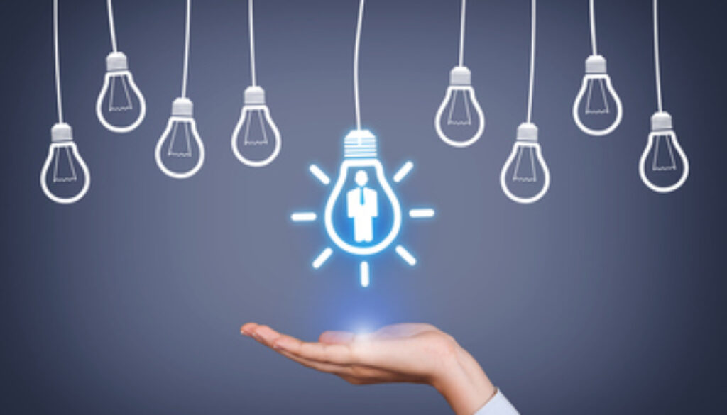 New Human Resource Idea Light Bulb on Human Hand