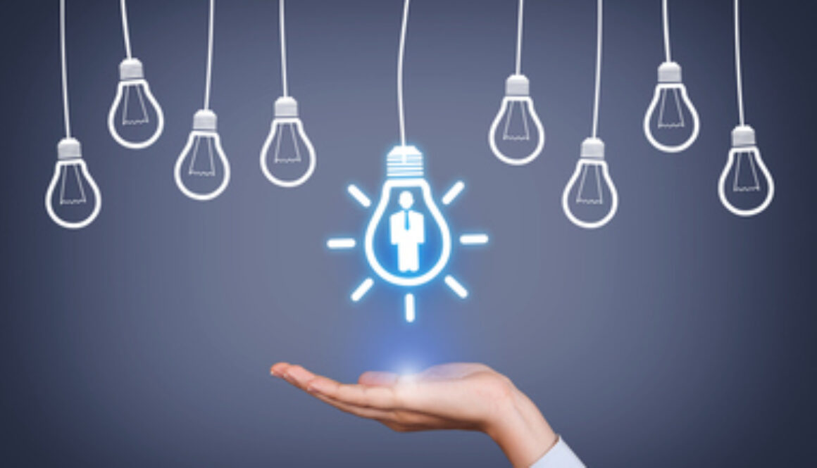 New Human Resource Idea Light Bulb on Human Hand