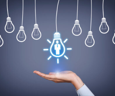 New Human Resource Idea Light Bulb on Human Hand